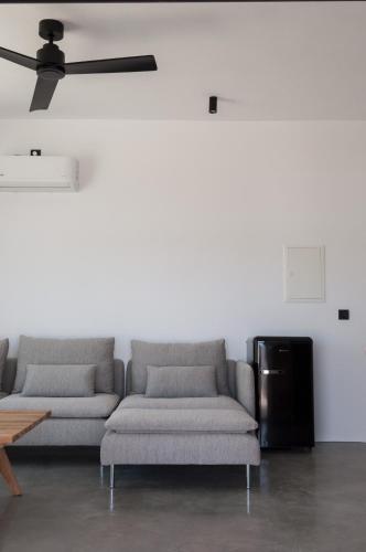 a living room with a couch and a table at Stremma Naxos in Aliko Beach