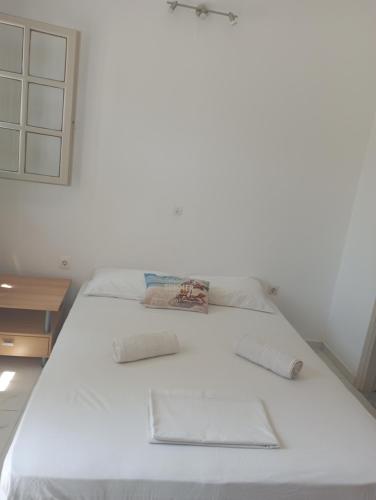 Uma cama ou camas num quarto em Tsagaropoulou Apartment