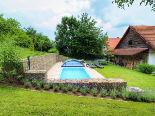 a swimming pool in the yard of a house at Holiday Home Libel by Interhome in Libel