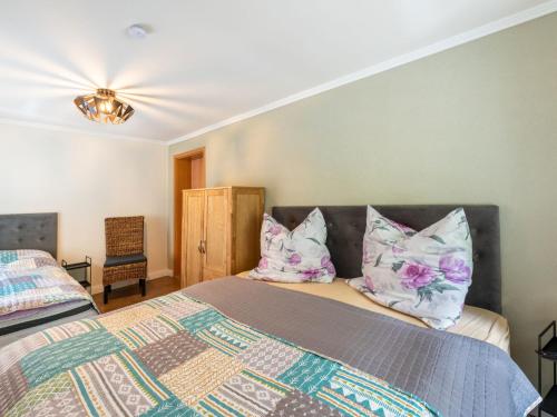 a bedroom with a bed with two pillows on it at Holiday Home Dunja by Interhome in Hain