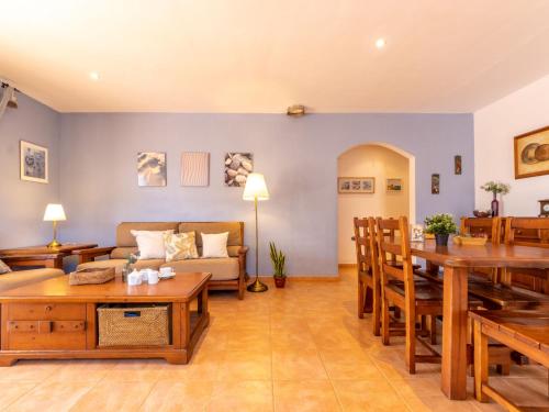 a living room with a couch and a table at Holiday Home Marinera by Interhome in Riumar
