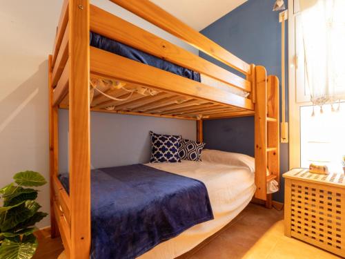 a bunk bed in a room with a bunk beduteneway at Holiday Home Marinera by Interhome in Riumar