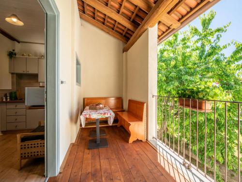 a patio with a table on a balcony at Apartment L'appartamento del Monastero by Interhome in Dronero