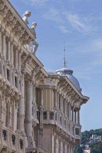 a building with a dome on top of it at Palace Suite in Trieste