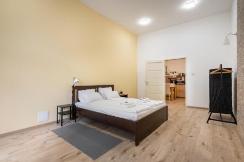 A bed or beds in a room at Peachy Homes Apartment