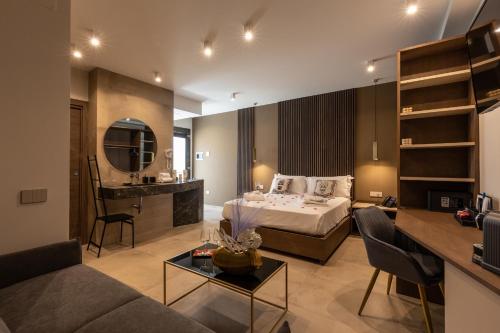 a bedroom with a bed and a living room at Giafra Luxury Rooms in Agrigento