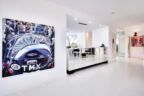a room with a picture of a car on the wall at Mondial Resort & Spa in Marina di Pietrasanta