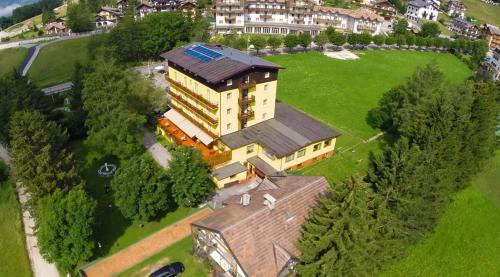 an aerial view of a large house with a roof at Hotel Rech-Hof Sayonara in Folgaria