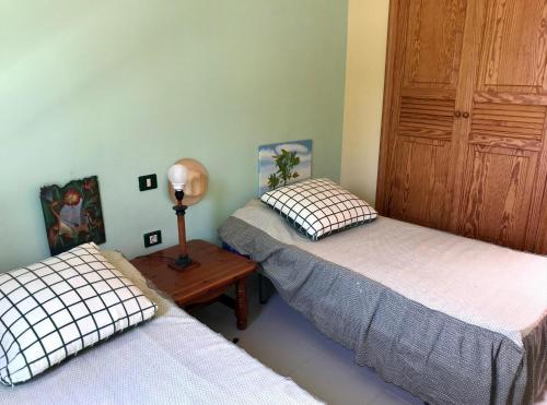Postel nebo postele na pokoji v ubytování Casa Palmeras Costa