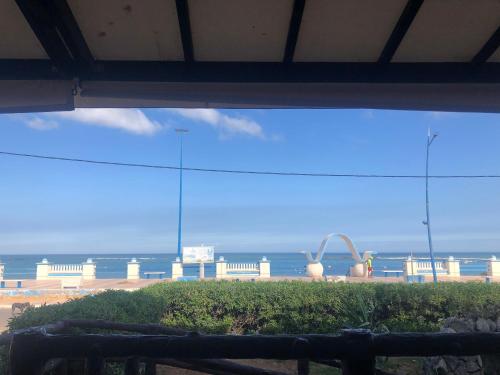 a view of a beach with a view of the ocean at Dar SAADA maison de sylvie in Souira Guedima