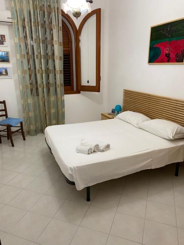 Postel nebo postele na pokoji v ubytování Appartamenti san vito lo capo