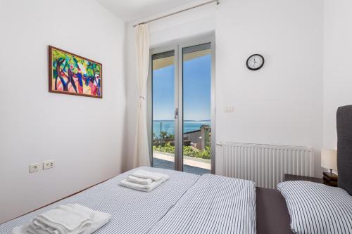 Posteľ alebo postele v izbe v ubytovaní Stella Premium Apartment Opatija