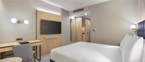 Ένα ή περισσότερα κρεβάτια σε δωμάτιο στο Doubletree By Hilton Plovdiv Center