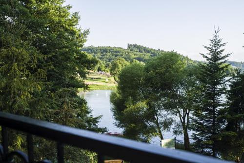 a view of a river from a balcony at U Lipińskich - Dom nad jeziorem in Ostrzyce