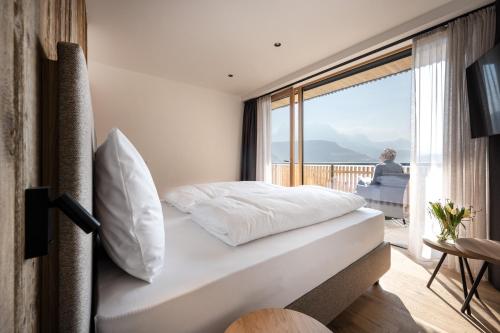 Postel nebo postele na pokoji v ubytování Oberfallerhof Apartment Aui