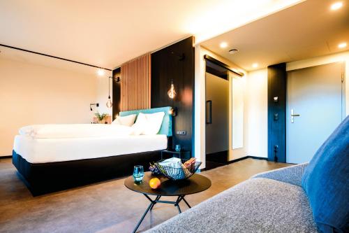Llit o llits en una habitació de Aqua Blu Hotel