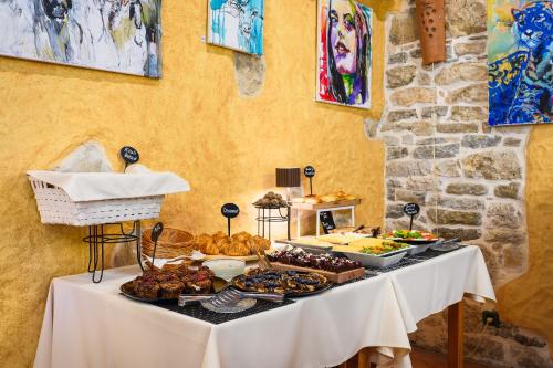 a table with a buffet of food on it at Ponte Porton Dining & lodging in Grožnjan