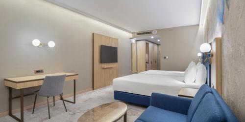 Ένα ή περισσότερα κρεβάτια σε δωμάτιο στο Doubletree By Hilton Plovdiv Center