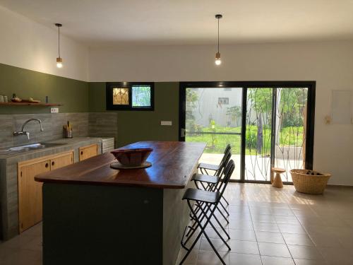 a kitchen with a large island in the middle at Villa Soforal in Cap Skirring