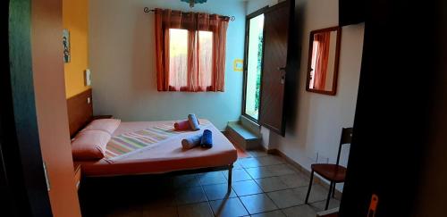 Vuode tai vuoteita majoituspaikassa Guesthouse Affittacamere Goloritzè