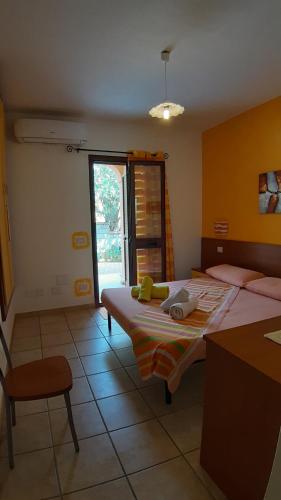 Ένα ή περισσότερα κρεβάτια σε δωμάτιο στο Guesthouse Affittacamere Goloritzè