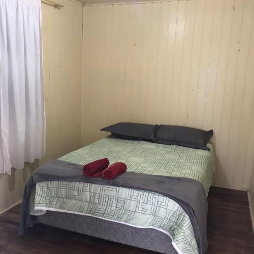 מיטה או מיטות בחדר ב-RECANTO DA VÓ NINIDA