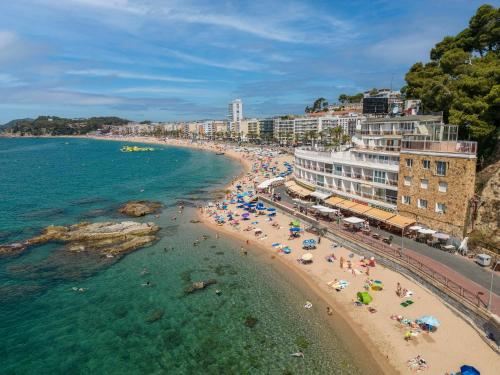 an aerial view of a beach with people in the water at Hotel Rosamar Maxim 4*- Adults Only in Lloret de Mar
