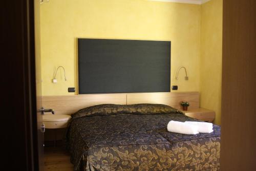 a hotel room with a bed and a sink at Suite - La Casa del Maestro in Pragelato