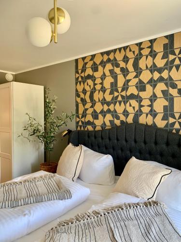 Postel nebo postele na pokoji v ubytování FeWo Prora - Designapartment Sir Henry