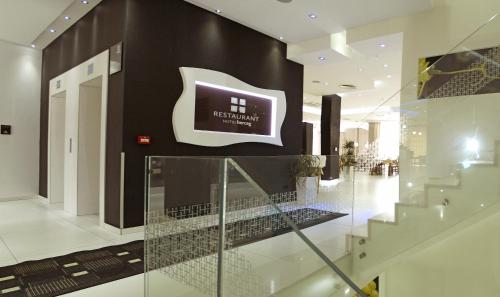 a lobby with a sign on the wall of a building at Hotel Herceg in Međugorje