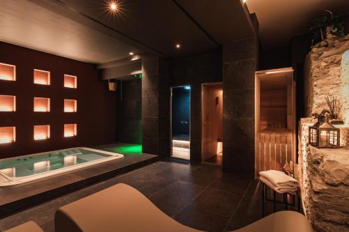 a bathroom with a jacuzzi tub in a room at SeePort Hotel in Ancona