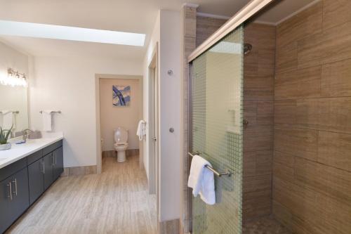 a bathroom with a glass shower with a toilet at Holiday Inn Express Wisconsin Dells by IHG in Wisconsin Dells