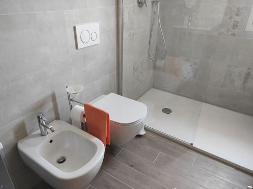a bathroom with a sink and a toilet and a shower at Affittacamere Villa Mary in Pistoia