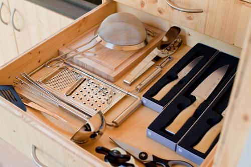 a drawer filled with utensils in a kitchen at Tiny House Nature 3 - Green Tiny Village Harz in Osterode