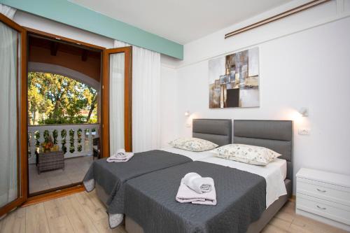Postel nebo postele na pokoji v ubytování Apartmani Marica