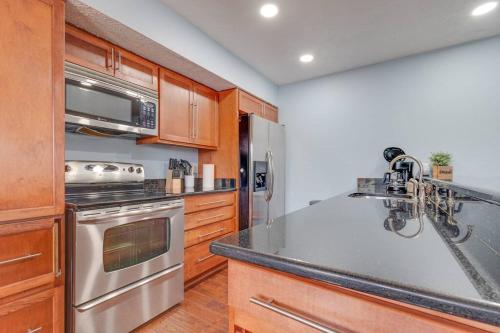 a kitchen with a sink and a stove top oven at Cozy 3br/2bath vacation house at Lake Travis in Lago Vista