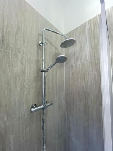 a shower with a shower head in a bathroom at Sweet relax in Cassino