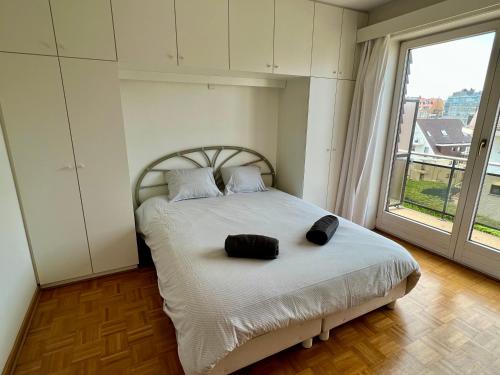 Appartement Duinbergen tesisinde bir odada yatak veya yataklar