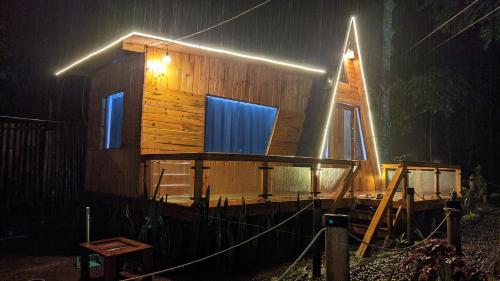 a cabin on a boat in the rain at night at Penginapan segitiga in Bandung