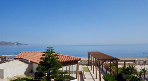 a building with a view of the beach at Minoica Beach Apartments in Amoudara Herakliou