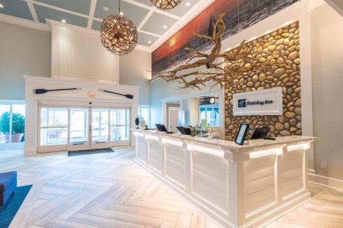 a lobby with a bar in a building at Holiday Inn Manahawkin/Long Beach Island by IHG in Manahawkin