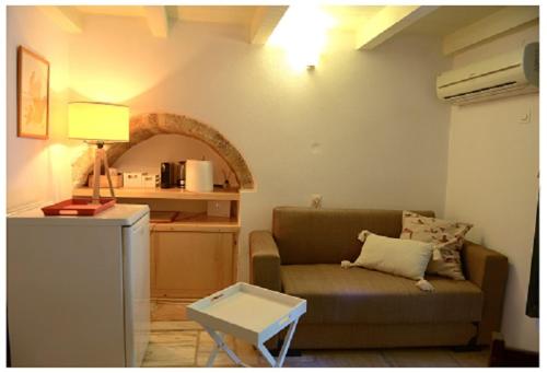 A seating area at NEFELI castle stone house inside the fortress