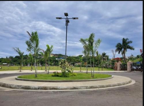 a roundabout with a street light in a park at Luxury Manor 2 Bedroom /1 Bathroom House w/electric fireplace, in Montego Bay