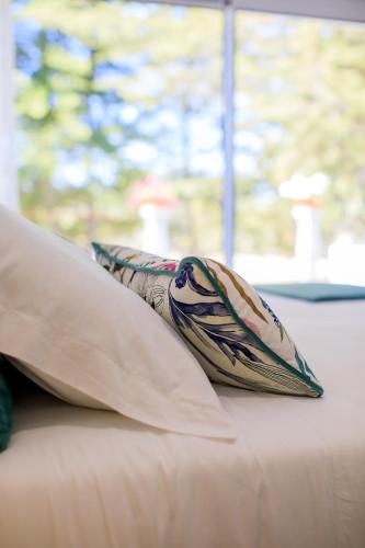 a pillow sitting on top of a couch at Hotel Campo do Rosmaninho in Castelo Branco
