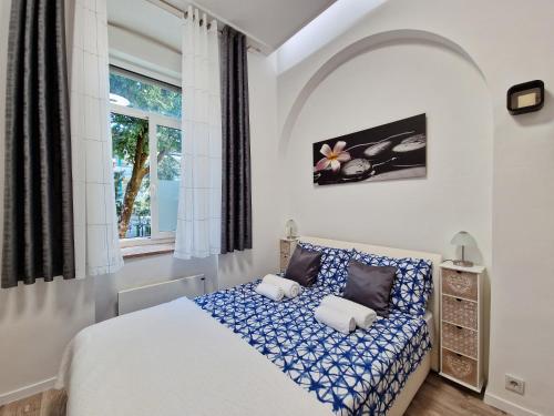 a bedroom with a bed and a window at Green garden in Zagreb