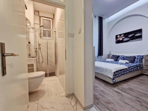 a bathroom with a bed and a shower and a toilet at Green garden in Zagreb