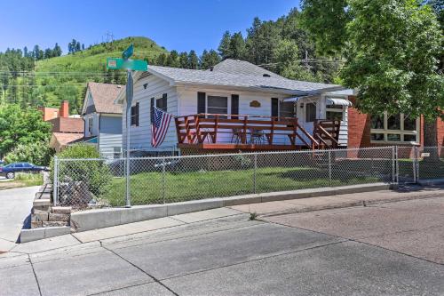 a house with a fence in front of it at Sleek Deadwood Getaway Less Than 1 Mi to Downtown! in Deadwood