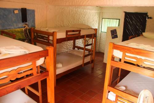 a group of bunk beds in a room at Praba Hostel in Palomino