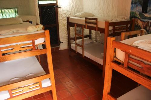a group of bunk beds in a room at Praba Hostel in Palomino