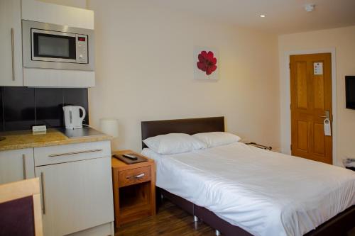 Kuchyň nebo kuchyňský kout v ubytování Marylebone Inn